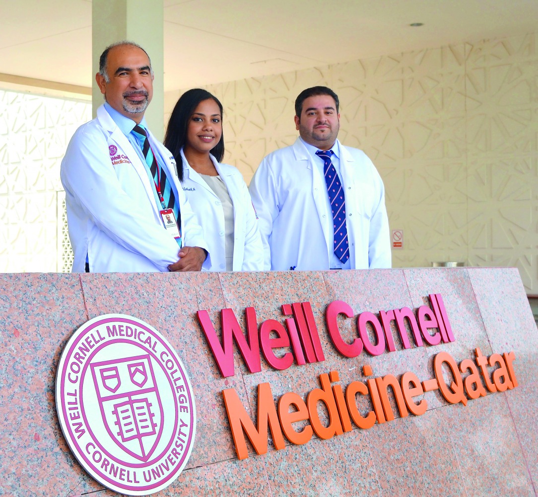 WCM-Q researchers pose for a photograph at WCM-Q yesterday. 