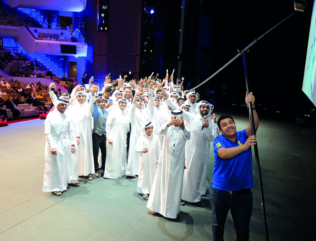 Graduates of Sky Climbers second batch setting a Guinness World record by taking a selfie with the world’s longest Selfie stick at QNCC. Pic Abdul Basit / The Peninsula.