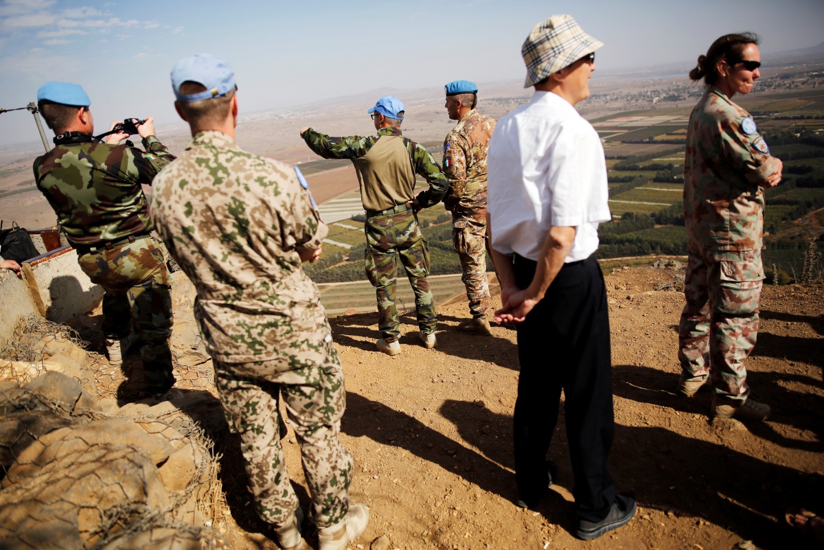 U.N. peacekeepers patrol as tourists visit Mount Bental, an observation post in the Israeli occupied Golan Heights near the ceasefire line between Israel and Syria October 23, 2017. Reuters/Amir Cohen