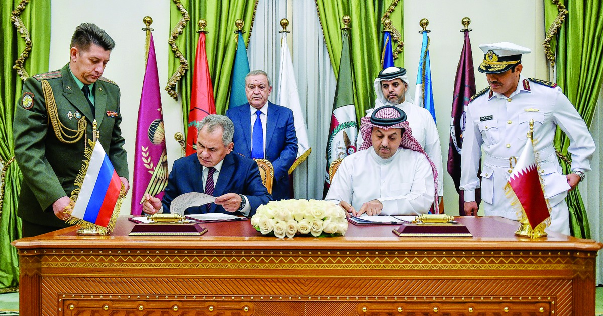 Minister of State for Defence Affairs H E Dr Khalid bin Mohamed Al Attiyah and Russian Defence Minister Sergey Shoygu signing an agreement. 