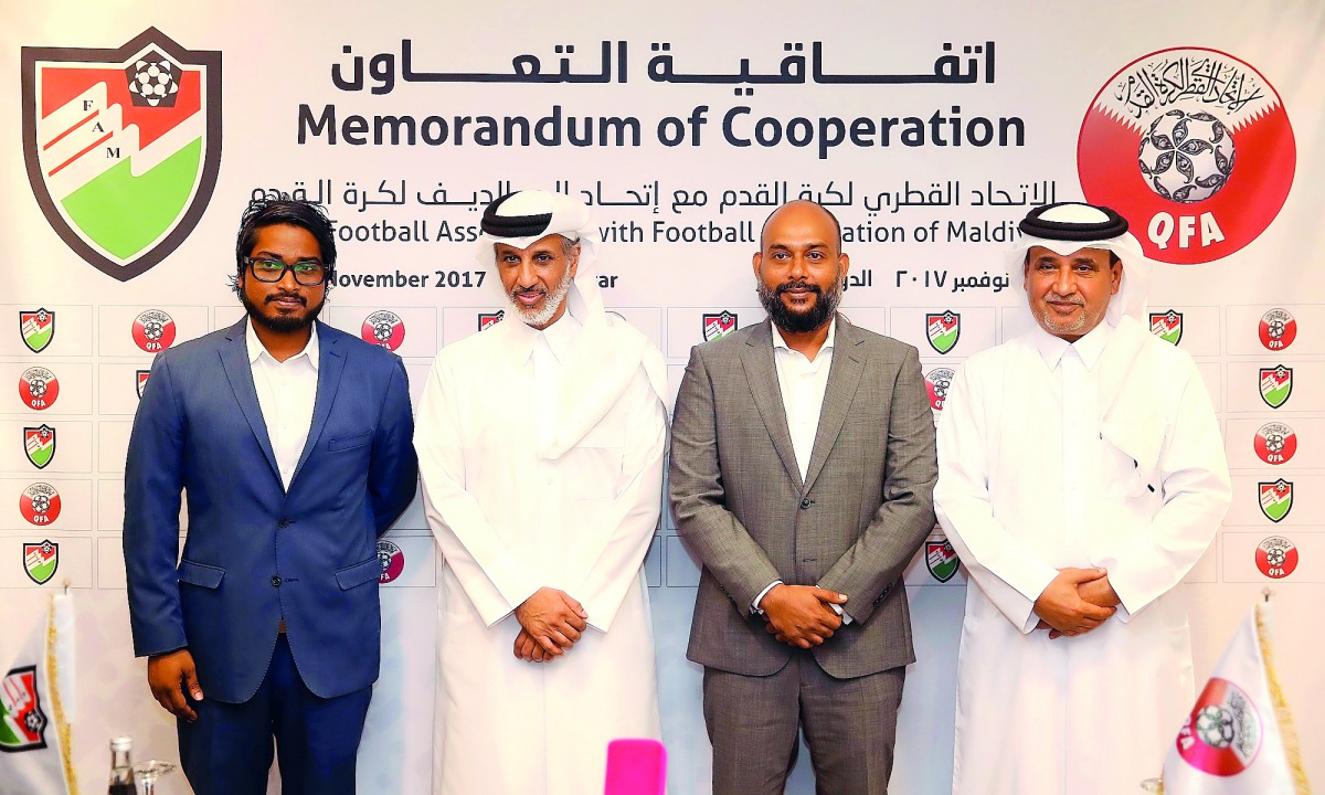 Sheikh Hamad bin Khalifa bin Ahmed Al Thani, President of the QFA, Bassam Adeel Jaleel, President of the FAM, and Saoud Al Mohannadi, Vice-President of the QFA pose for a group picture after the agreement signing ceremony in Doha yesterday.