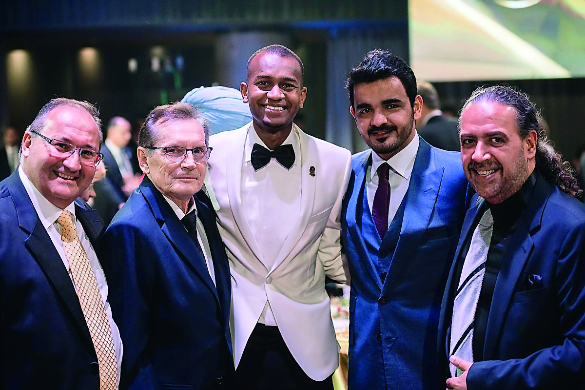 The President of Qatar Olympic Committee (QOC)  H E Sheikh Joaan bin Hamad Al Thani and star Qatari high jumper Mutaz Barshim (centre) pose for a group picture along with other officials, after the National Olympic Committee (ANOC) Awards Ceremony in Prag