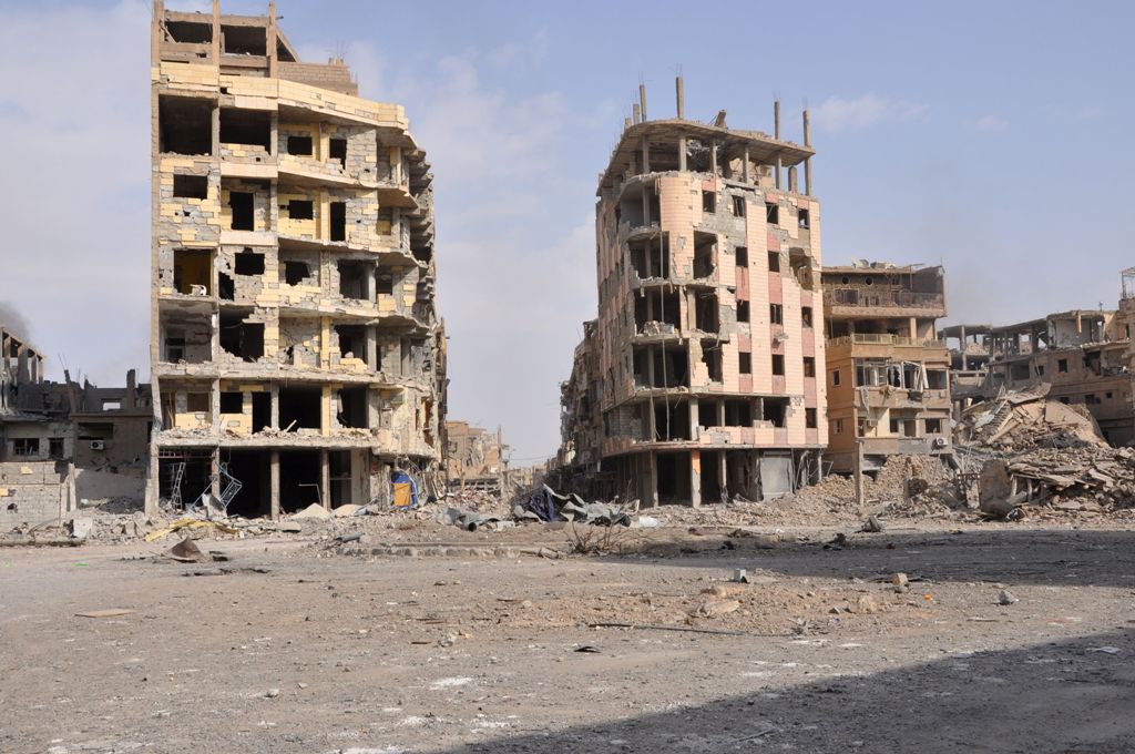 A general view shows damaged buildings in the eastern Syrian city of Deir Ezzor on November 4, 2017.   AFP