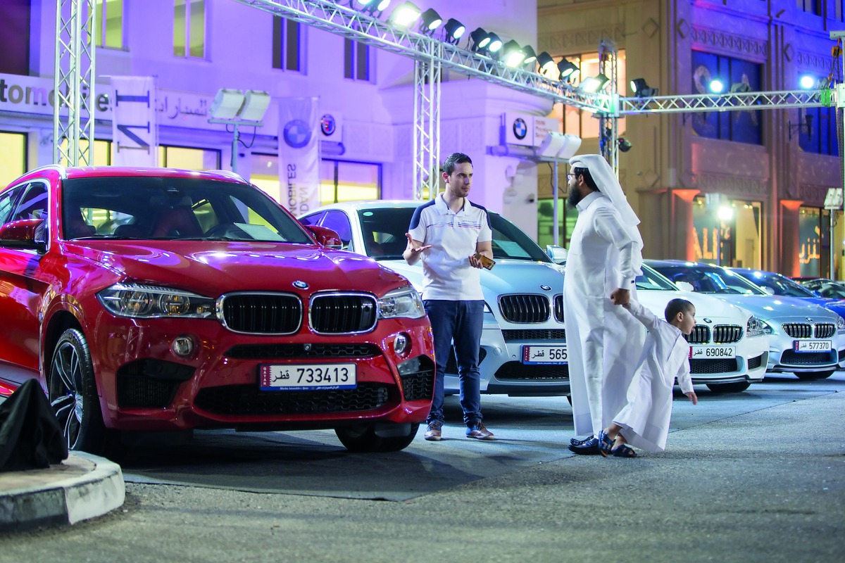 Customers at the weekend extravaganza of Alfardan Automobiles at the used cars showroom in Al Sadd.