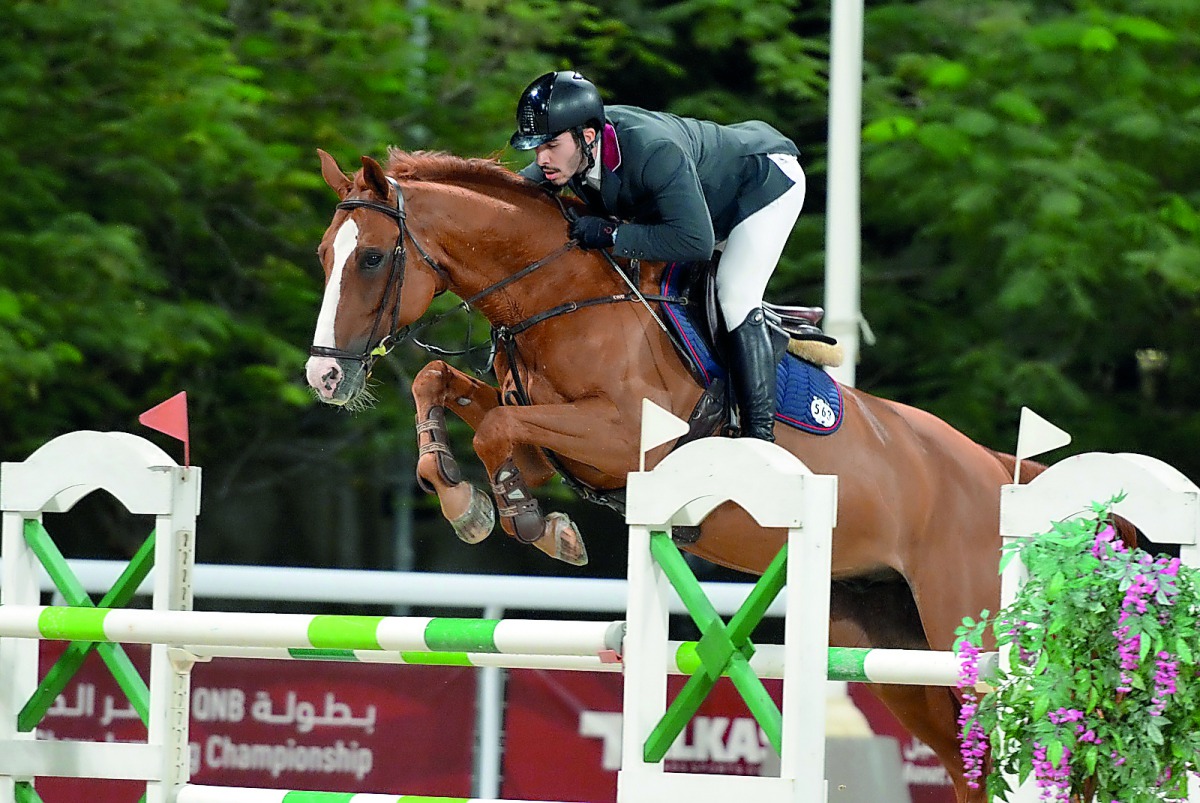 Star of the day, Young Qatari rider Salman Mohammed Al Emadi guides his 16-year-old gelding Zorro Z over an obstacle during the 145cm class event of the QNB Qatar International Show Jumping Championship which kicked off at the Qatar Equestrian Federation’