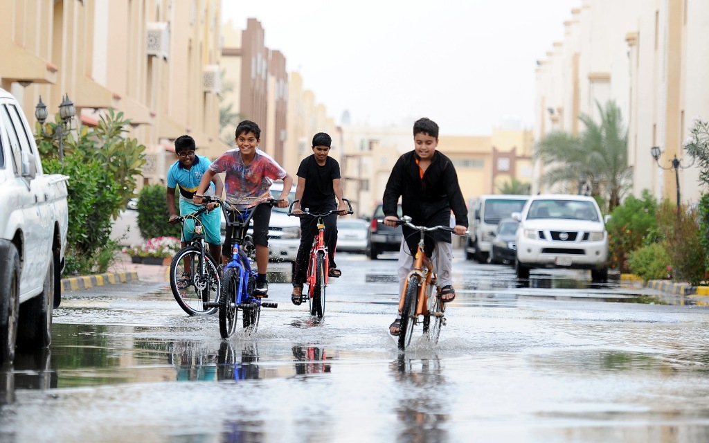 Children playing in rain water logged in a residencial compound in Al Wukair. Salim Matramkot © The Peninsula
