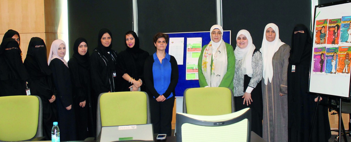 Officials of the Ministry of Public Health and Injaz Qatar pose for the picture at the workshop.