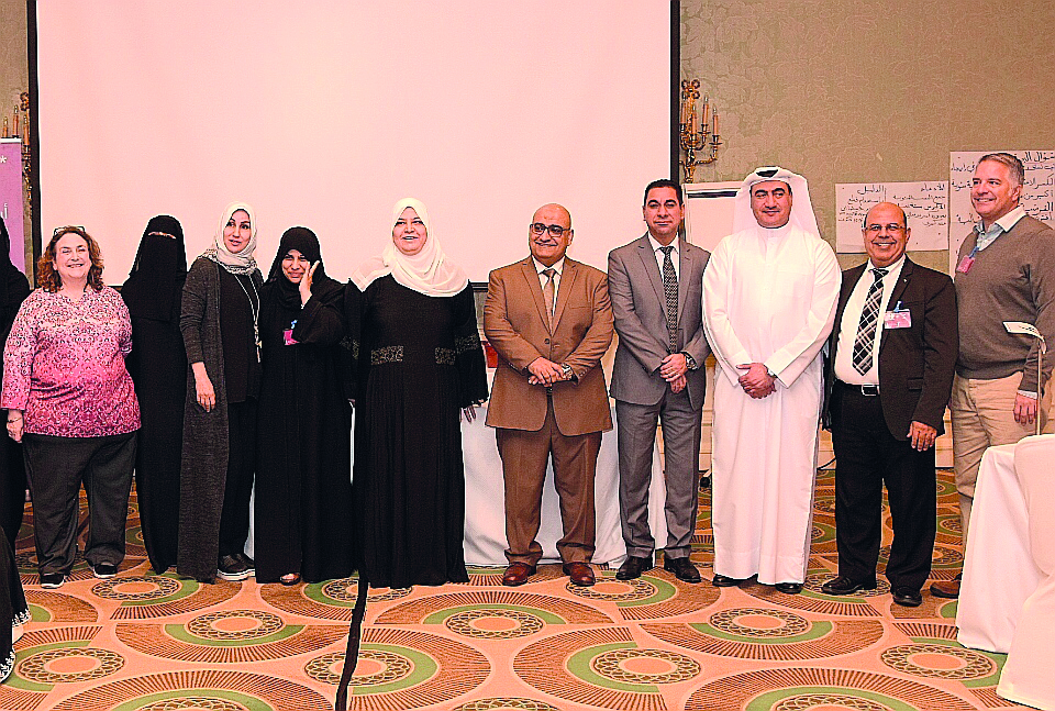 Officials with teachers during the ceremony.