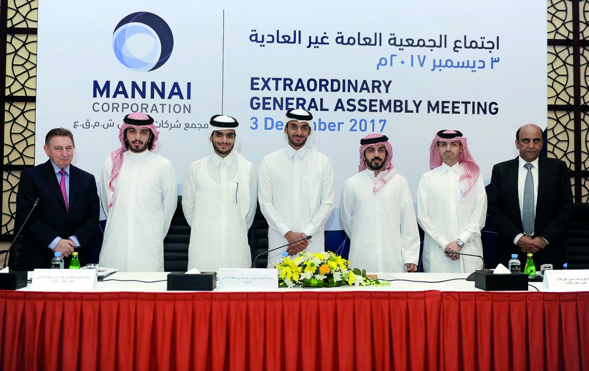 Sheikh Suhaim bin Abdullah Al Thani, Vice-Chairman of Mannai Corporation (fourth left) with other board members and officials during the Extraordinary General Assembly Meeting (EGM) at InterContinental Hotel-Doha, yesterday. Pic: Abdul Basit/The Peninsula
