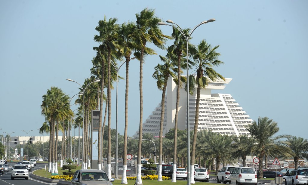 Palm trees on the  divider of the Corniche road swaying in the strong wind. January 5, 2016. Salim Matramkot © The Peninsula