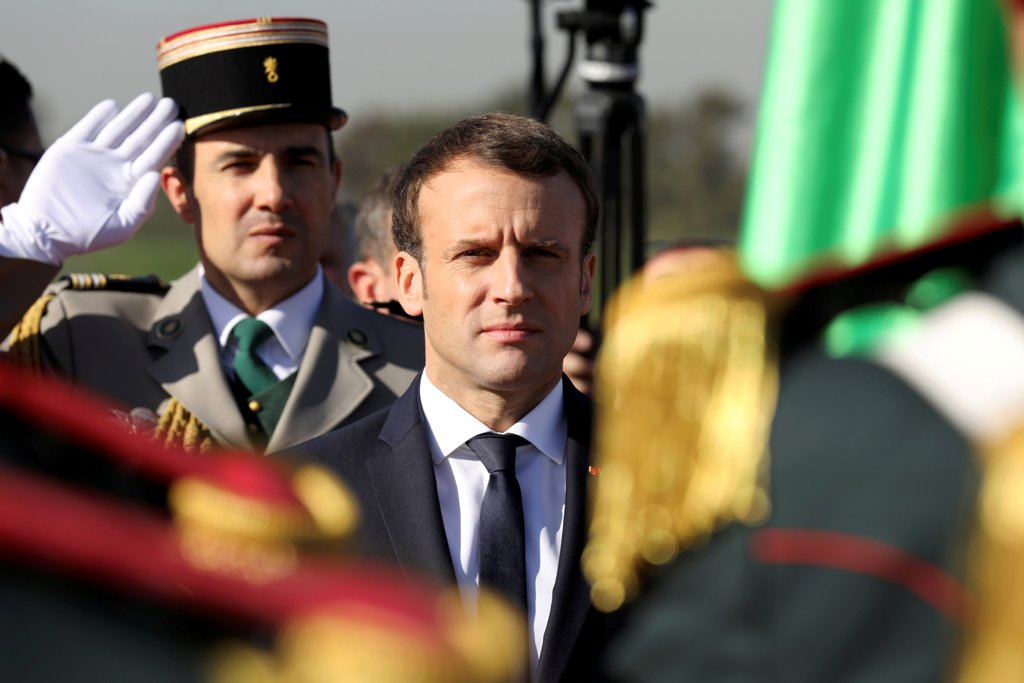 French President Emmanuel Macron reviews troops at Algiers Airport following his arrival in Algiers, Algeria, December 6, 2017. REUTERS/Ludovic Marin/Pool
