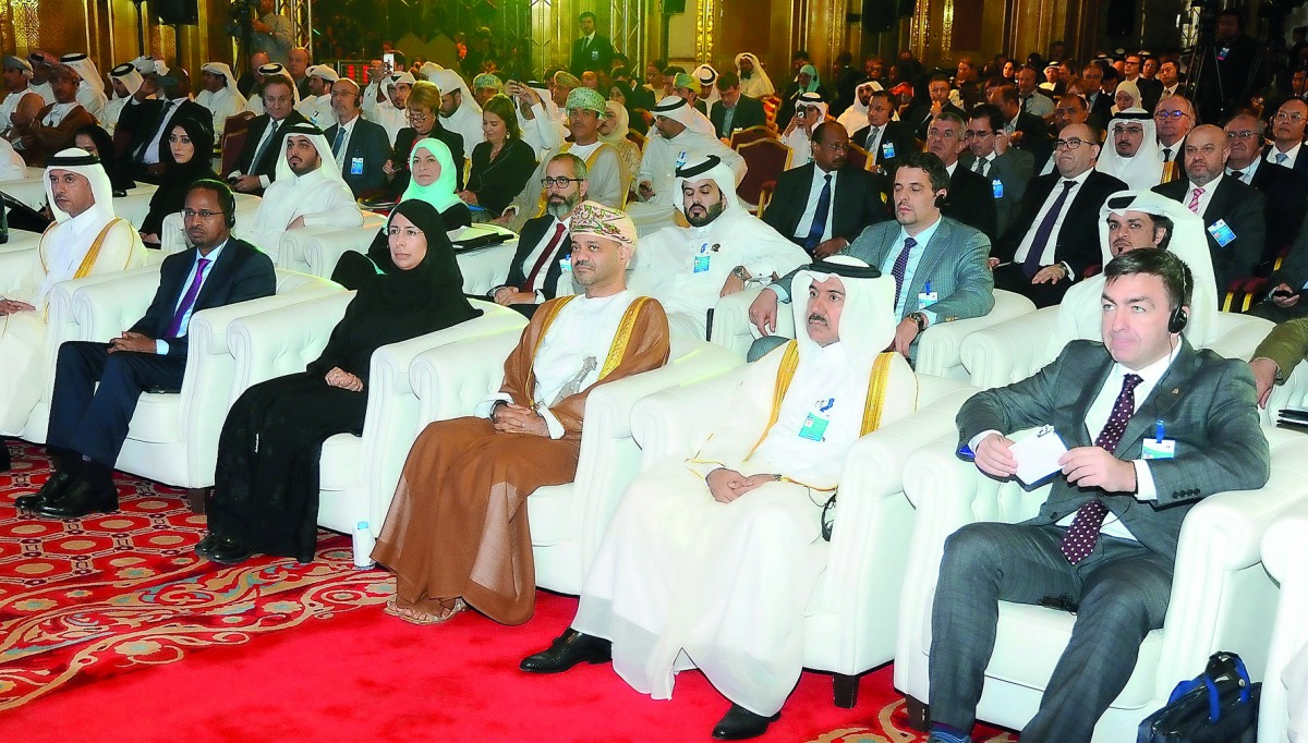 Minister of Administrative Development, Labour and Social Affairs H E Dr Issa bin Saad Al Jafali Al Nuaimi (extreme left) and H E Minister of Public Health Dr Hanan Mohamed Al Kuwari (third left) during the 5th Interpol Global Conference on Trafficking in