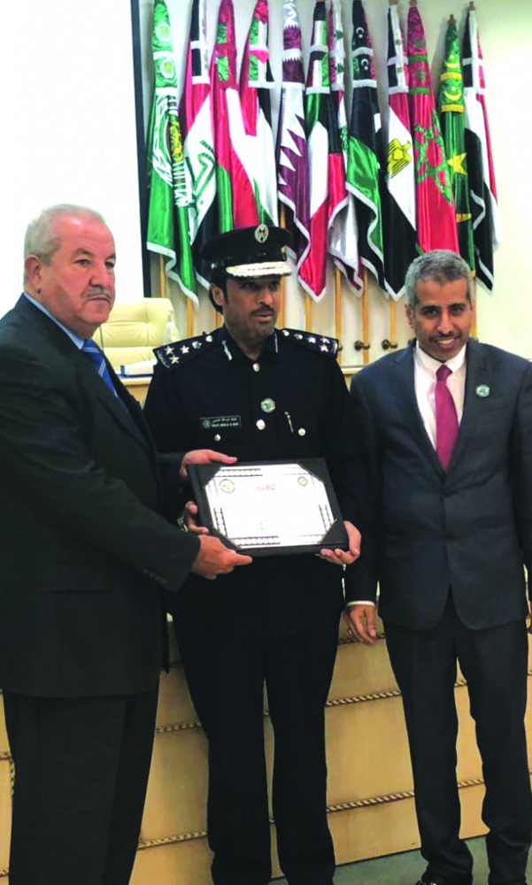 Officials with the prize.