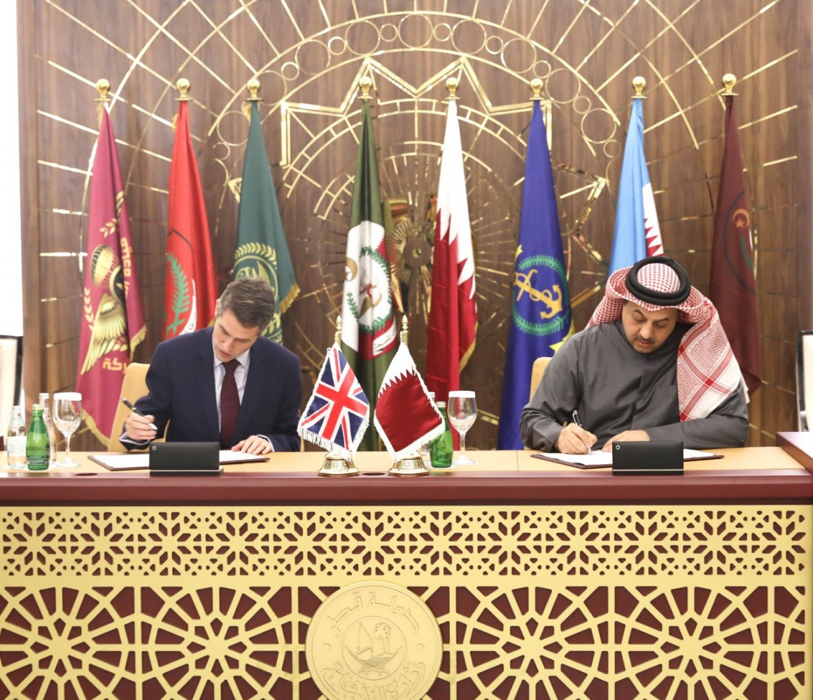 DOHA, QATAR - DECEMBER 10: Defence Secretary of United Kingdom, Gavin Williamson (L) and Minister of State for Defense of Qatar Khalid bin Mohammad Al Attiyah (R) sign an agreement on the sale of Eurofighter Typhoon type jet fighters to Qatar after a meet