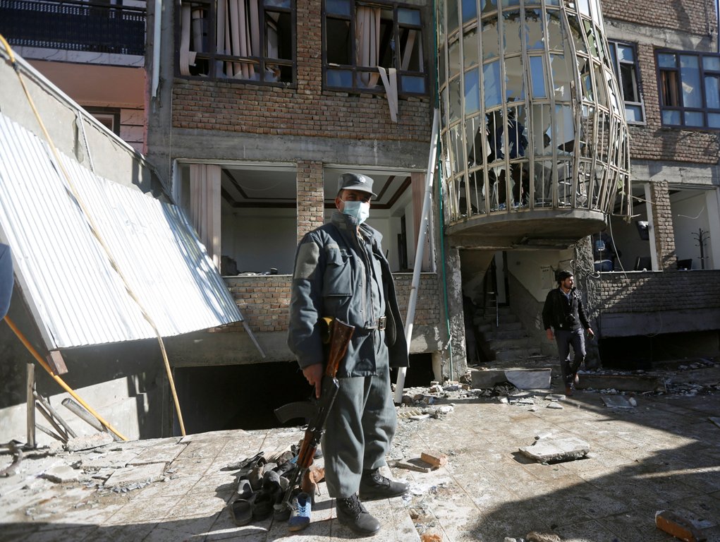 An Afghan policeman keeps watch at the site of a suicide attack in Kabul, Afghanistan December 28, 2017. REUTERS/Omar Sobhani