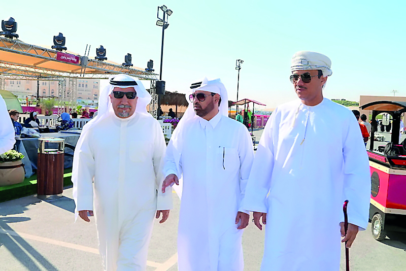 Katara General Manager Dr. Khalid bin Ibrahim Al Sulaiti accompanying Kuwait Ambassador Hafiz Mohammad Al Ajmi and Oman Ambassador Najib bin Yahya Al Balushi during a tour of the fair at the Mahaseel Festival.