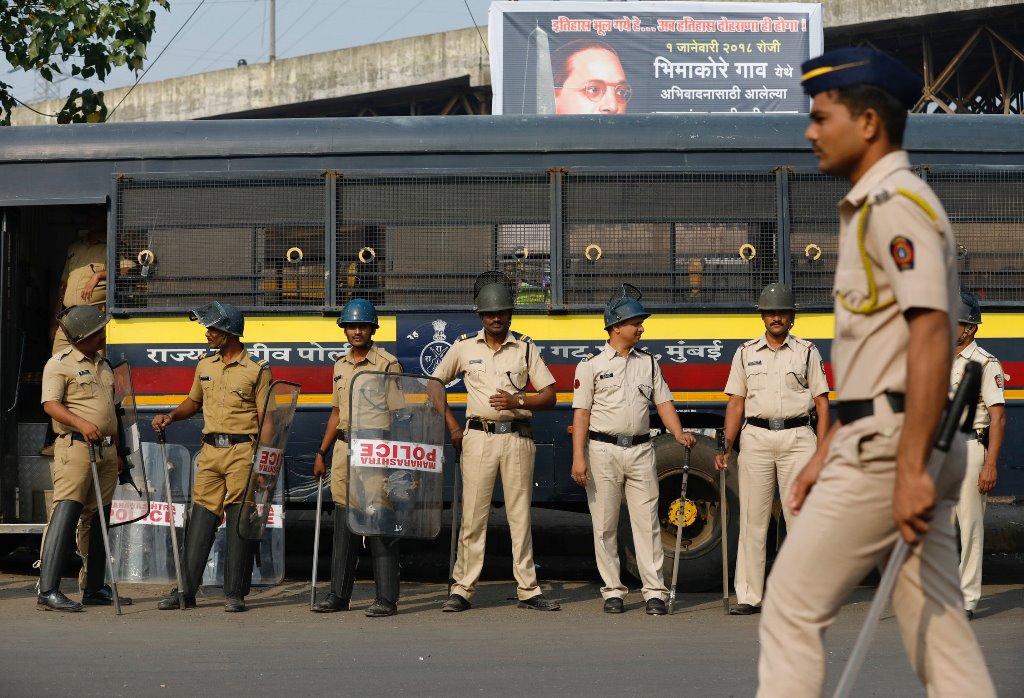 Policemen stand guard at a traffic junction in Mumbai, India, January 3, 2018. REUTERS/Danish Siddiqui
