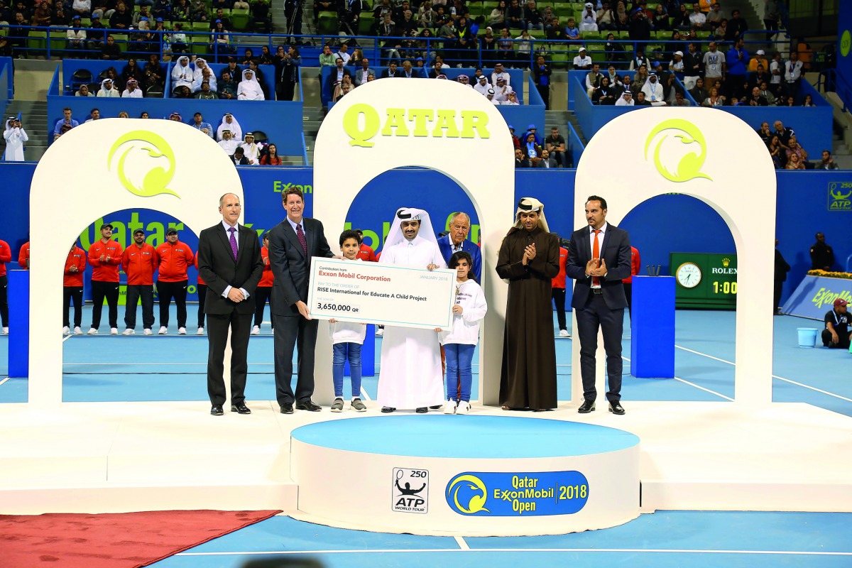 Officials with children during the cheque handing over ceremony.