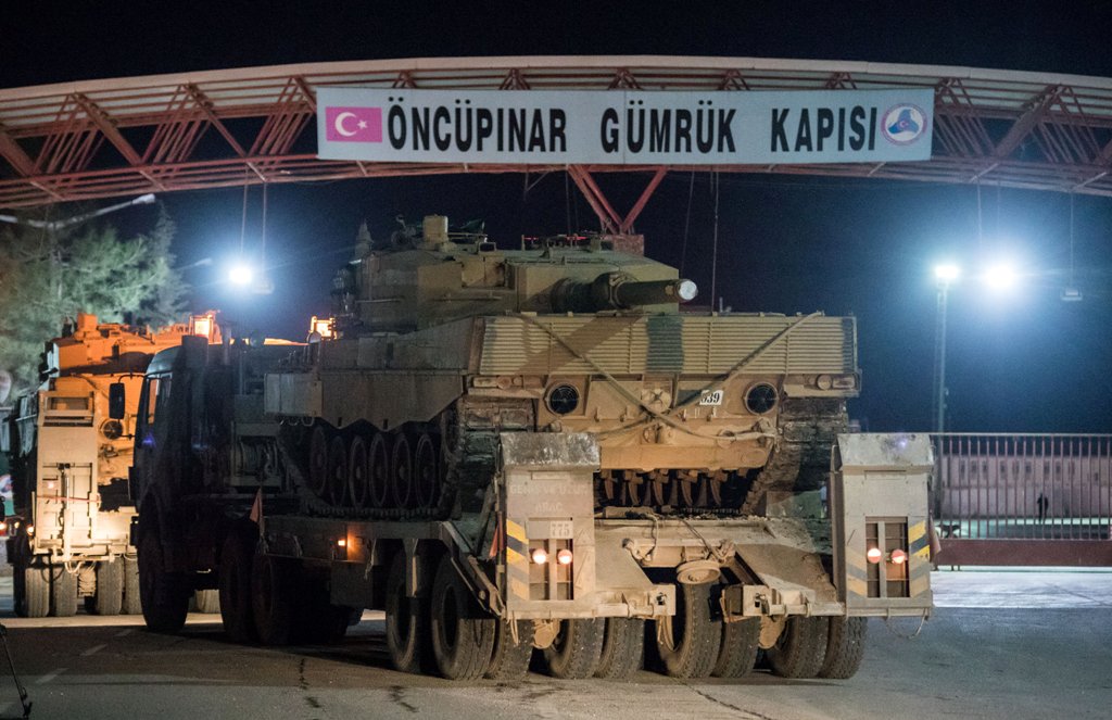 Turkish military vehicles cross into Syria at Oncupinar border gate in Kilis, Turkey, January 20, 2018. Picture taken January 20, 2018. Can Erok/Dogan News Agency
