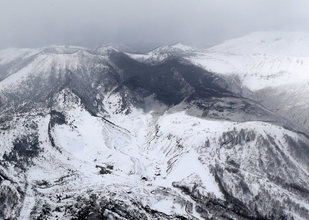 Photo taken from a Kyodo News helicopter on January 23, 2018, shows the area surrounding Mt. Kusatsushirane (top, L) in Gunma Prefecture, northwest of Tokyo, which erupted on the same day. Kyodo/via REUTERS 