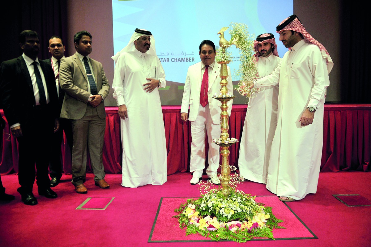 Mohammed bin Ahmed bin Towar Al Kuwari, Vice-Chairman of Qatar Chamber, and P.D.P.S.A. Liyanage, Sri Lankan Ambassador to Qatar, with other officials during the oil lamp lighting at the “Employment Promotion in Qatar” event held at the Sheraton Grand Doha