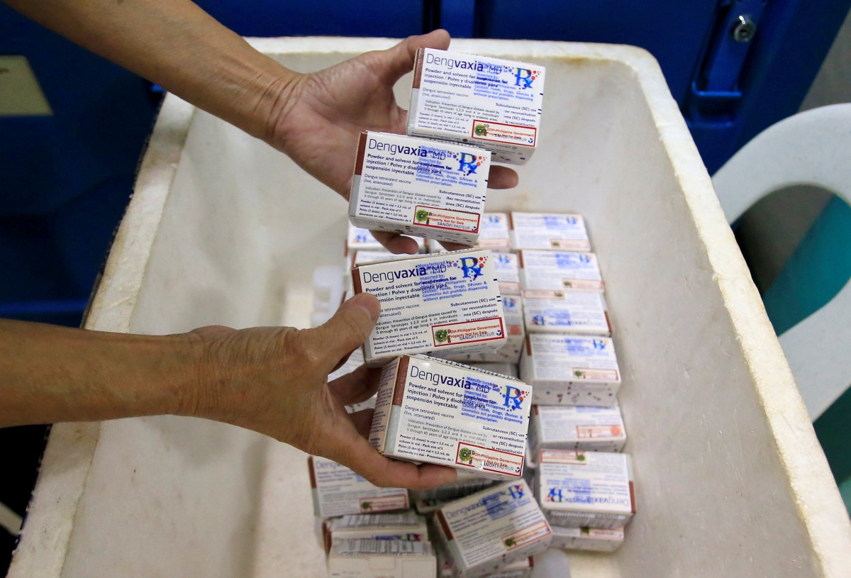A health worker shows unused packs of anti-dengue vaccine Dengvaxia before returning it inside a freezer for storage at the Manila Health Department in Sta Cruz, metro Manila, Philippines December 5, 2017. Reuters/Romeo Ranoco