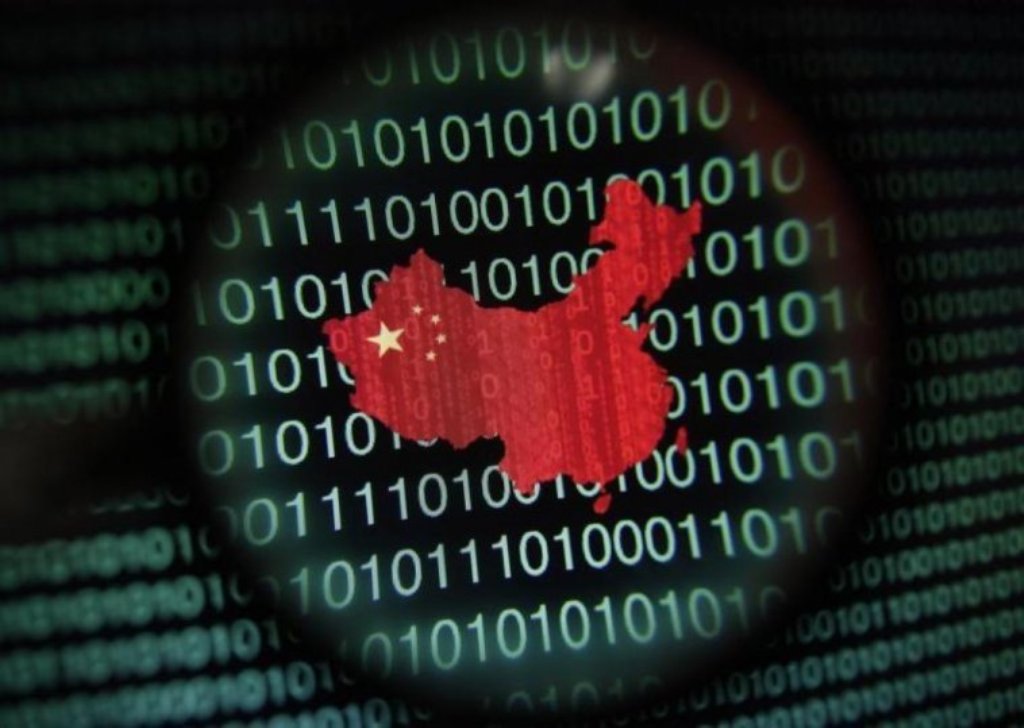 A map of China is seen through a magnifying glass on a computer screen showing binary digits in this photo illustration. REUTERS/Edgar Su 