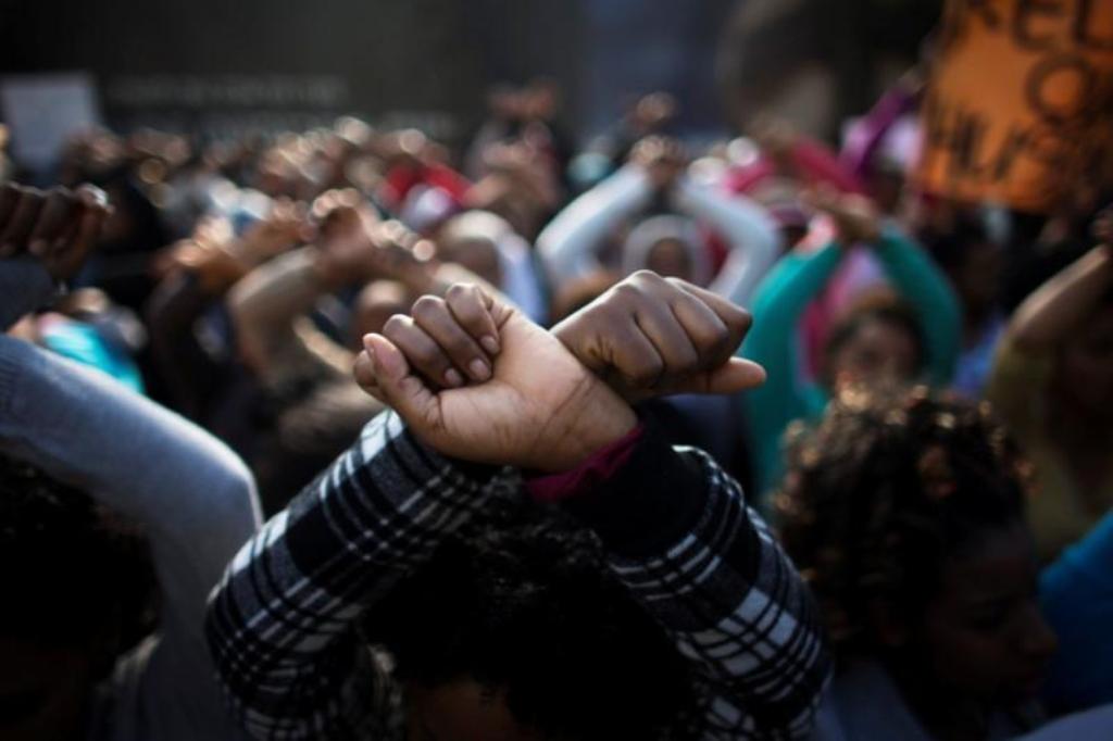File photo of an African migrant gesturing during a protest, held by women and children of the migrant community, against Israel's detention policy toward migrants, in Tel Aviv, Israel January 15, 2014. REUTERS/Ronen Zvulun/File Photo