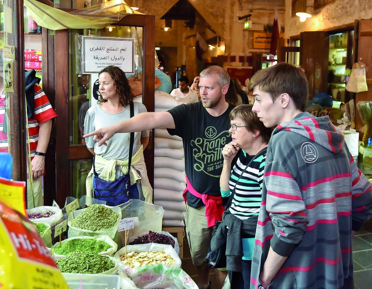 Participants of the Souq Waqif tours visit a section of the souq selling spices and herbs.