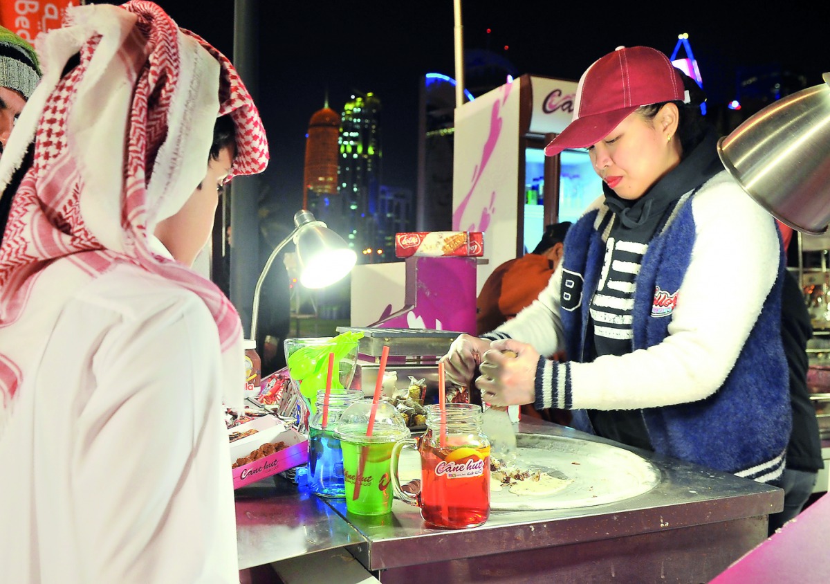 A local kid enjoying his treat from Cane Hut (part of Bedaya Center section) at CTC Festival held at Hotel Park yesterday.