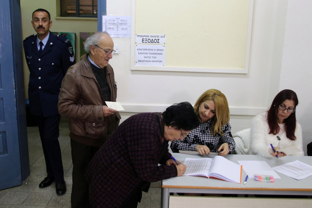 Voters are seen during the second round of the presidential election in Limassol, cyprus February 4, 2018. REUTERS/Yiannis Kourtoglou 