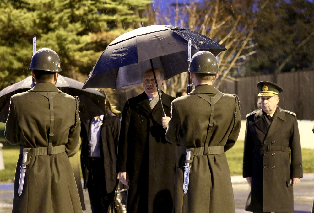 President of Turkey, Recep Tayyip Erdogan greets guard of honor ahead of their departure for Italy at the Ataturk International Airport in Istanbul, Turkey on February 04, 2018. (Berk Özkan /Anadolu Agency)