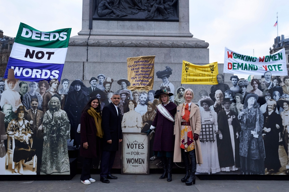  (L-R) Activist Amika George, The Mayor of London Sadiq Khan, historian Lucy Worsley and deputy mayor for culture and creativity Justine Simons pose in Trafalgar square against a backdrop of lifesize pictures of members of the Suffragete movement to mark 