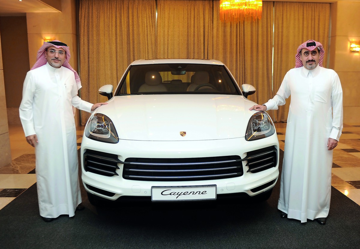 Salman Jassem Al Darwish, (right) Chairman and CEO of Porsche Centre Doha with Ahed Dawood, Brand Manager, Porsche Center Doha, during the launch of new model of Porsche Cayenne in Doha, yesterday. Pic: Abdul Basit