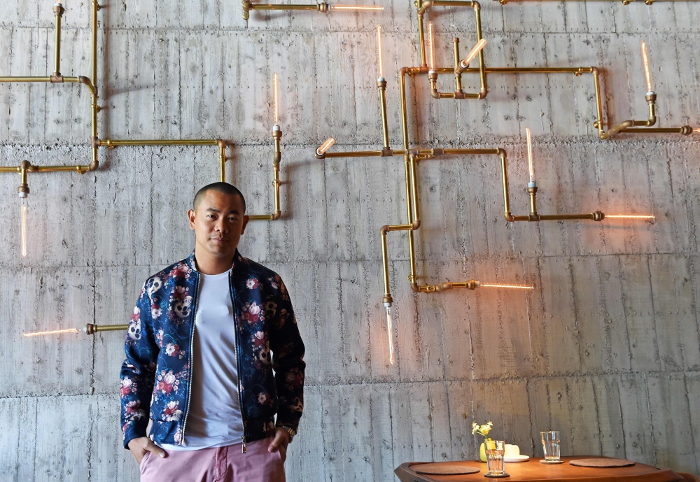 (FILES) In this file photo taken on April 14, 2015, Taiwanese star chef Andre Chiang poses for a photo at his restaurant RAW in Taipei. AFP / SAM YEH