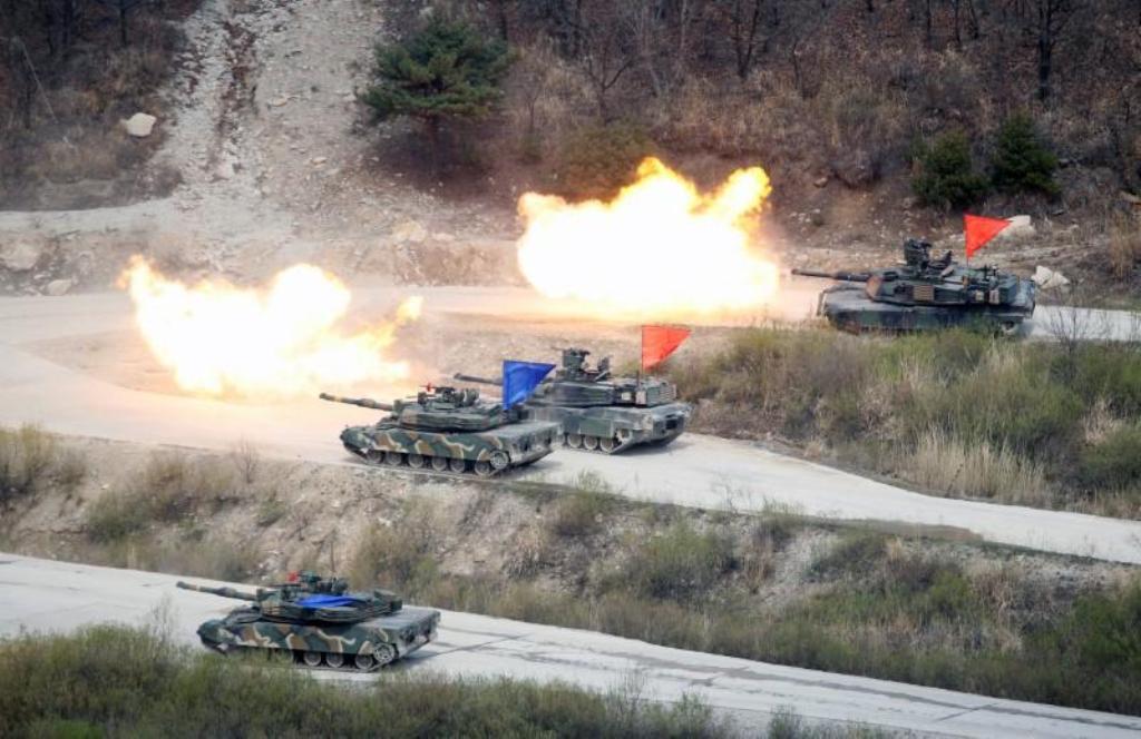 File photo of South Korean Army K1A1 and US Army M1A2 tanks fire live rounds during a US-South Korea joint live-fire military exercise, at a training field, near the demilitarized zone, separating the two Koreas in Pocheon, South Korea April 21, 2017. REU