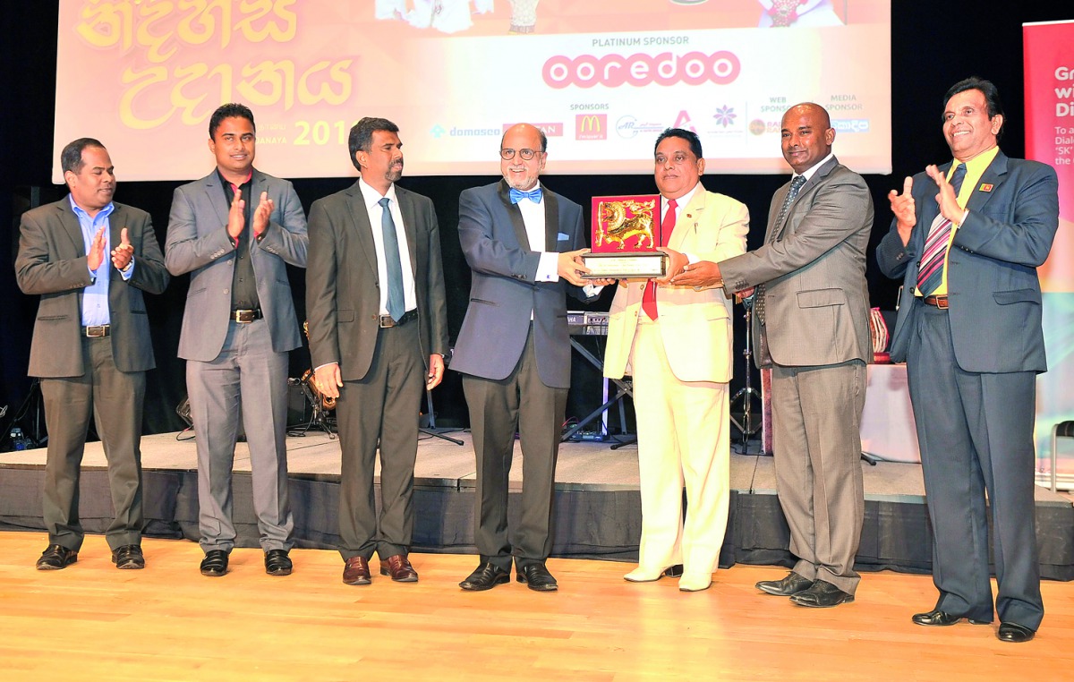 Dr R. Seetharaman (centre), Group CEO of Doha Bank, receives ‘Excellence Award’ from ASP Liyanage, Sri Lankan Ambassador to Qatar, and Sanath Kohowilage, President Sri Lanka Coordinating Committee Qatar, during the  cultural event held to celebrate Sri La