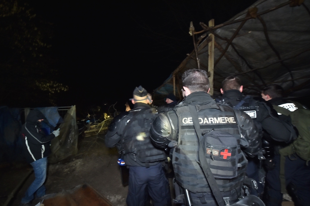 This handout photo released by the French Gendarmerie Nationale shows an operation by French gendarmes to evacuate opponents of a nuclear waste burial site in the Lejuc woods in Bure early on February 22, 2018. AFP PHOTO / GENDARMERIE NATIONALE 