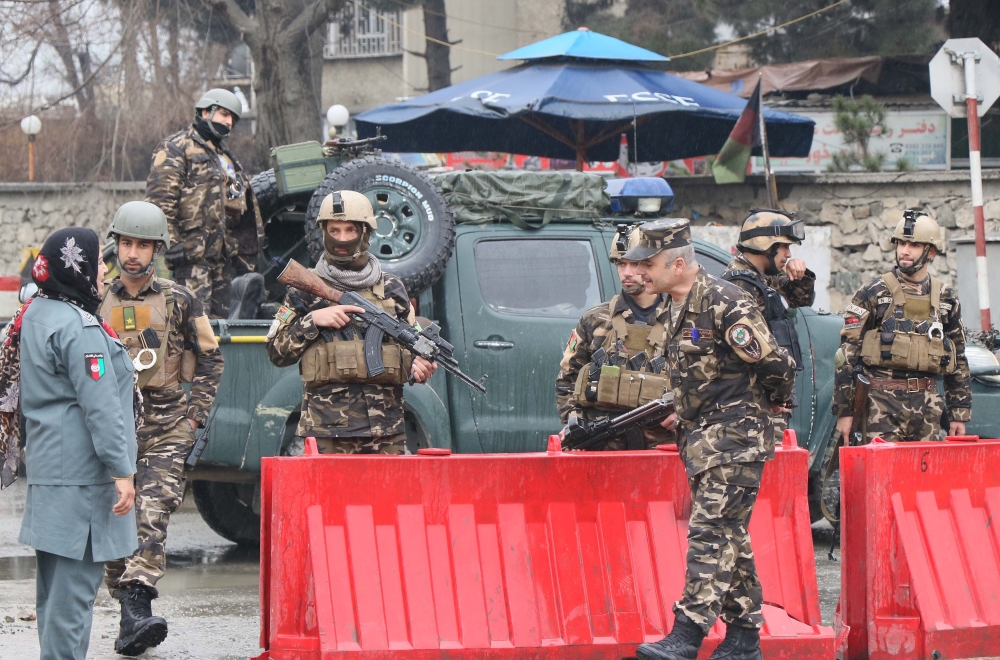 Afghan officials inspect the site after a suicide bomb attack in the Shash Darak area of Kabul, near NATO headquarters and not far from the US Embassy in Kabul, Afghanistan on February 24, 2018. Haroon Sabawoon / Anadolu Agency