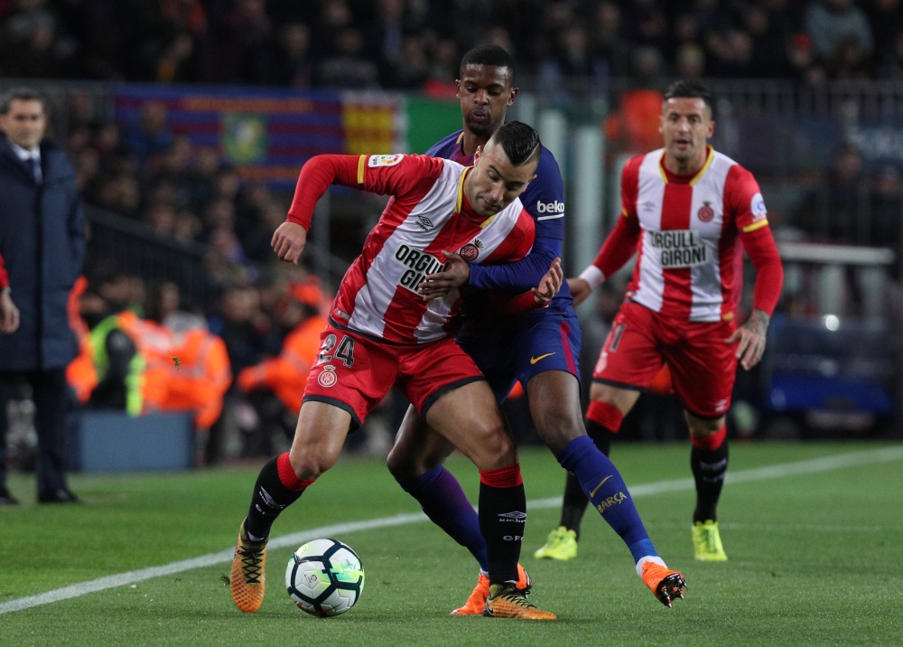 Girona's Borja in action with Barcelona’s Nelson Semedo REUTERS/Sergio Perez