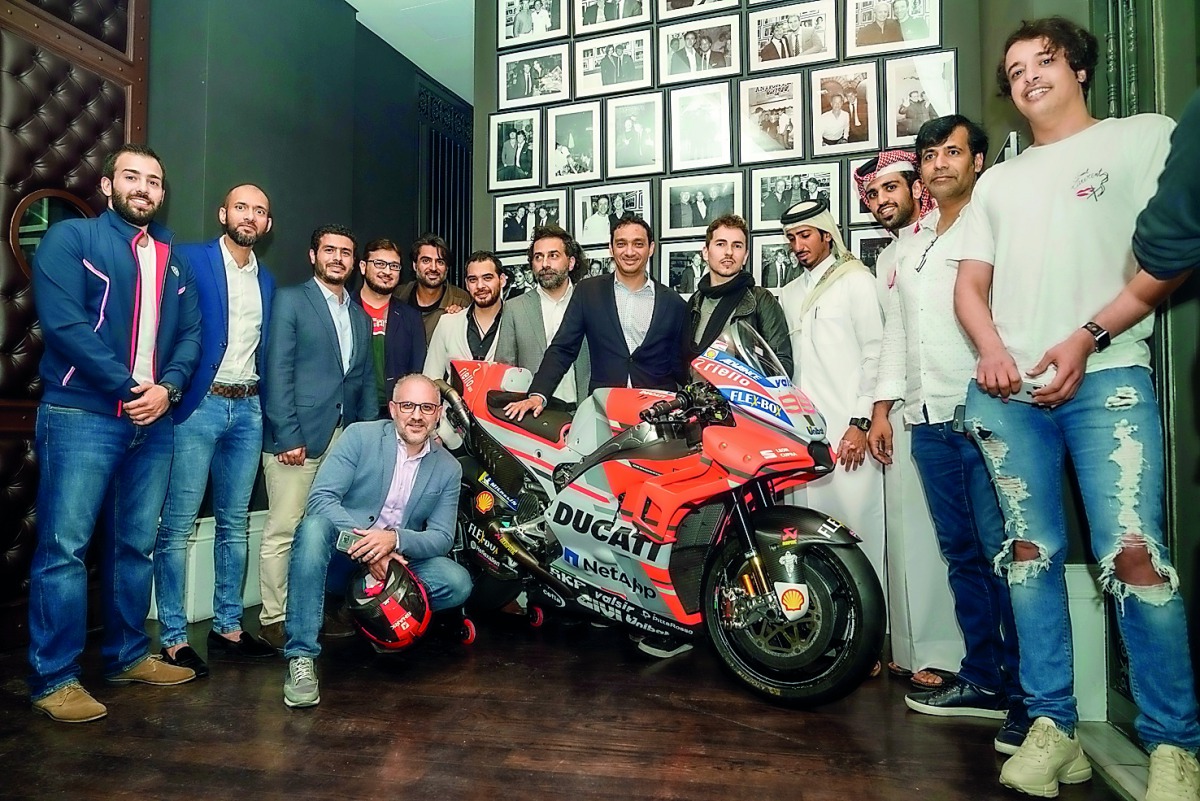 Participants pose for a group photo at the Ducati Party.