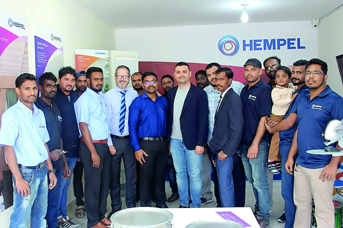 The staff of Hempel Paints during the opening of its newest multi-tint centre in Abu Hamour. 