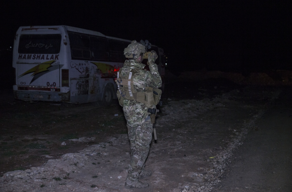 Turkish soldiers patrol with tank at night at the town center after Turkish Armed Forces and Free Syrian Army (FSA) took complete control of northwestern Syria's Afrin within the 