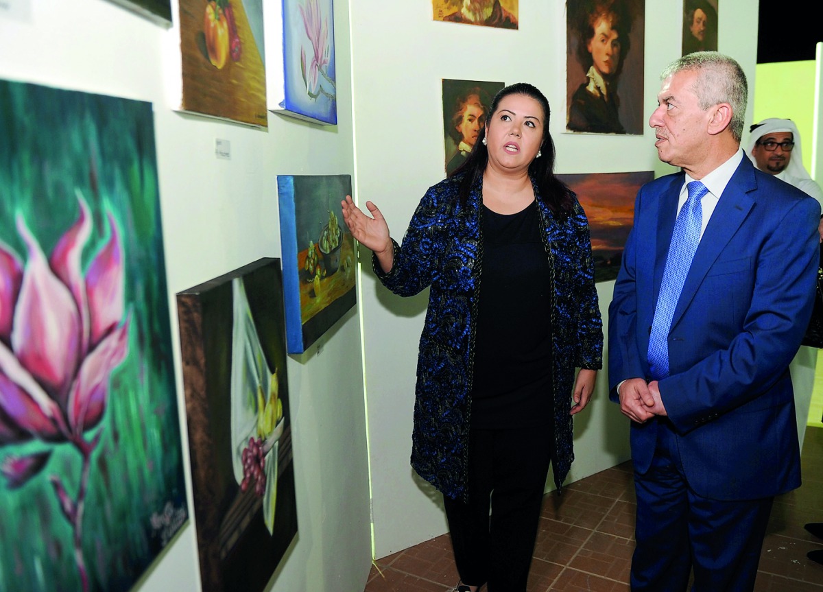 Hassan Najm (right), Ambassador of Lebanon to Qatar, with Lina Lotfi Moabi, Executive Director of Arts and Crafts, at the opening of annual fine art exhibition at Arts and Crafts Center on Wednesday. Pic: Abdul Basit / The Peninsula 