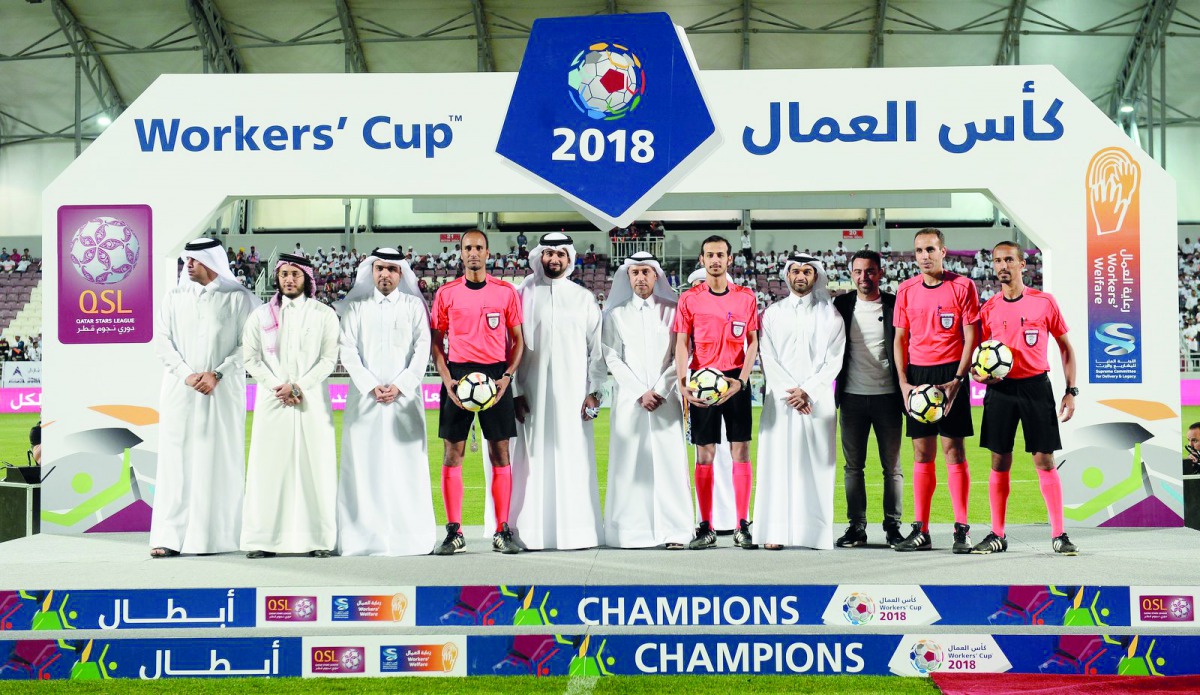 Minister of Administrative Development, Labour and Social Affairs, H E Dr Issa bin Saad Al Jafali Al Nuaimi  and Secretary-General of the Supreme Committee for Delivery & Legacy, Hassan Al Thawadi, with officials and referees during the final of Workers’ 