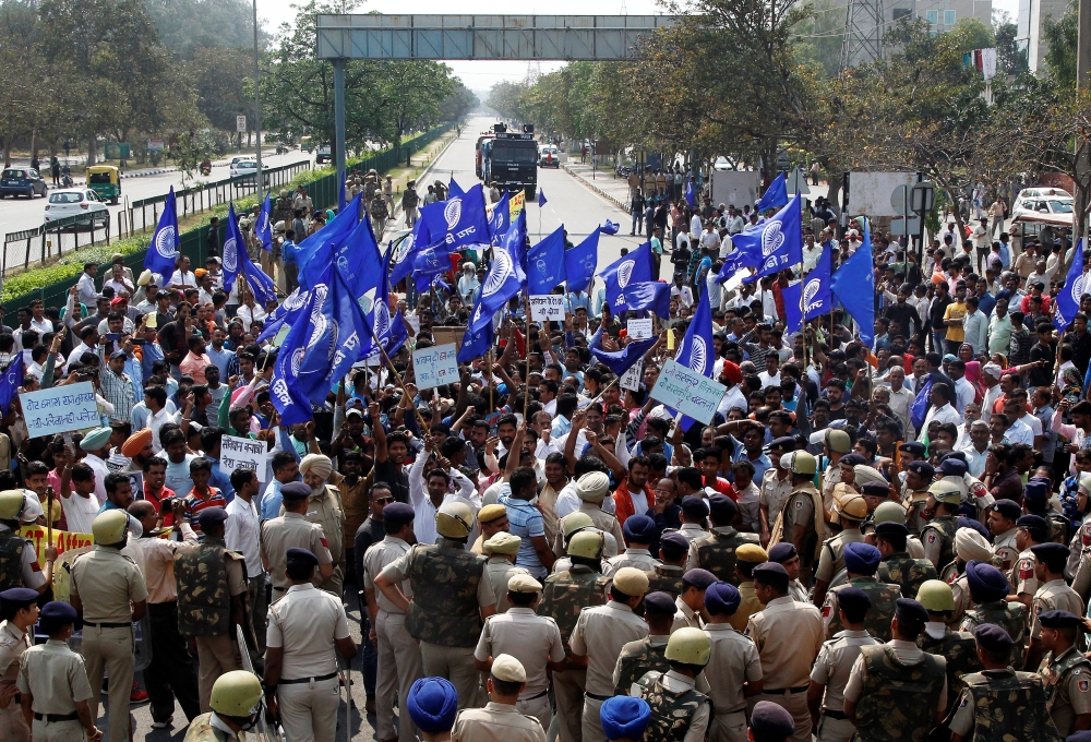 Police try to stop people belonging to the Dalit community as they take part in a protest during a nationwide strike called by Dalit organisations, in Chandigarh, India, April 2, 2018. REUTERS/Ajay Verma