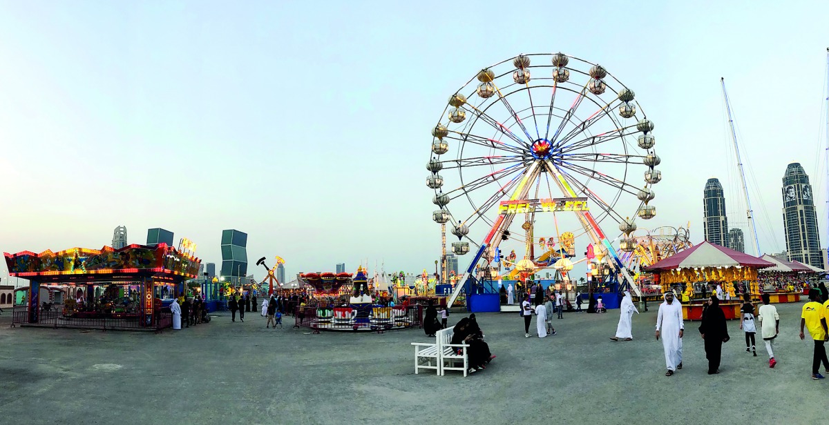 Visitors enjoy various rides at the Entertainment World Village located behind Diplomatic Club, yesterday.  Pic: Qassim Rahmatullah / The Peninsula 