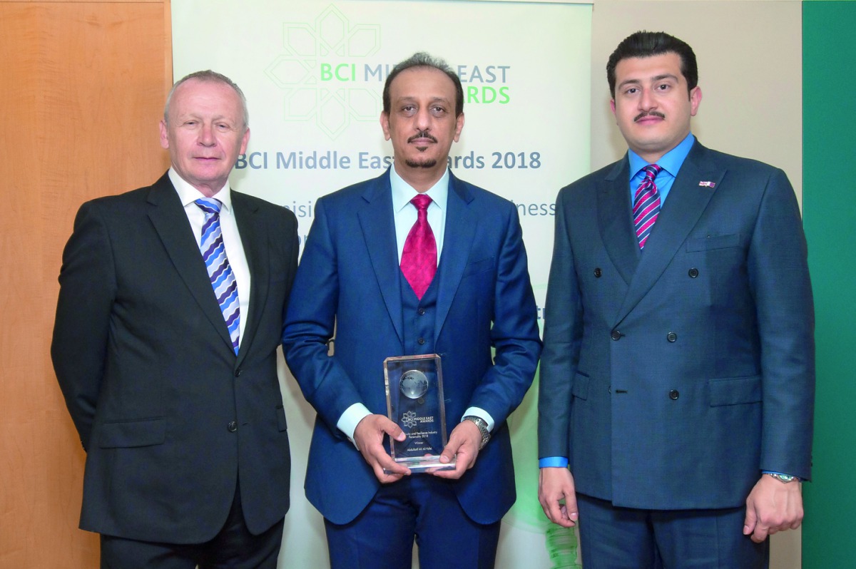 Abdullatif Ali Al Yafei (centre), Chairman of the Business Continuity Institute Qatar Forum, with other officials.