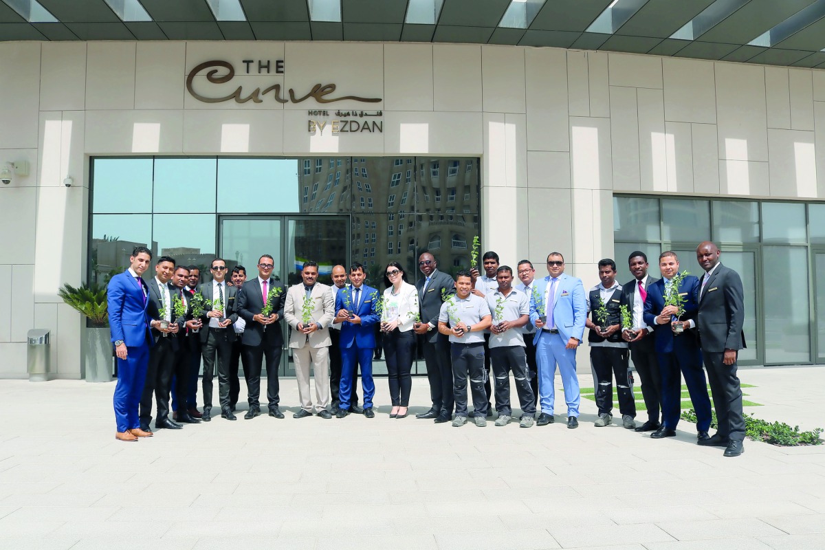 Ezdan Hotels Company staff during the celebration of World Earth Day.