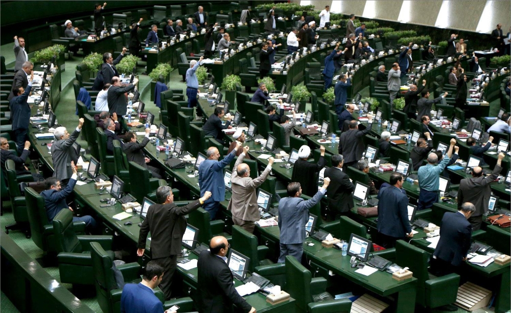 A handout picture provided by the Iranian Parliament on May 9, 2018 shows Iranian MPs chanting US slogans at the parliament in Tehran. AFP PHOTO / Islamic Consultative Assembly News Agency
 